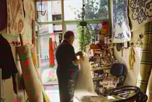 Textile business owner works in his shop.